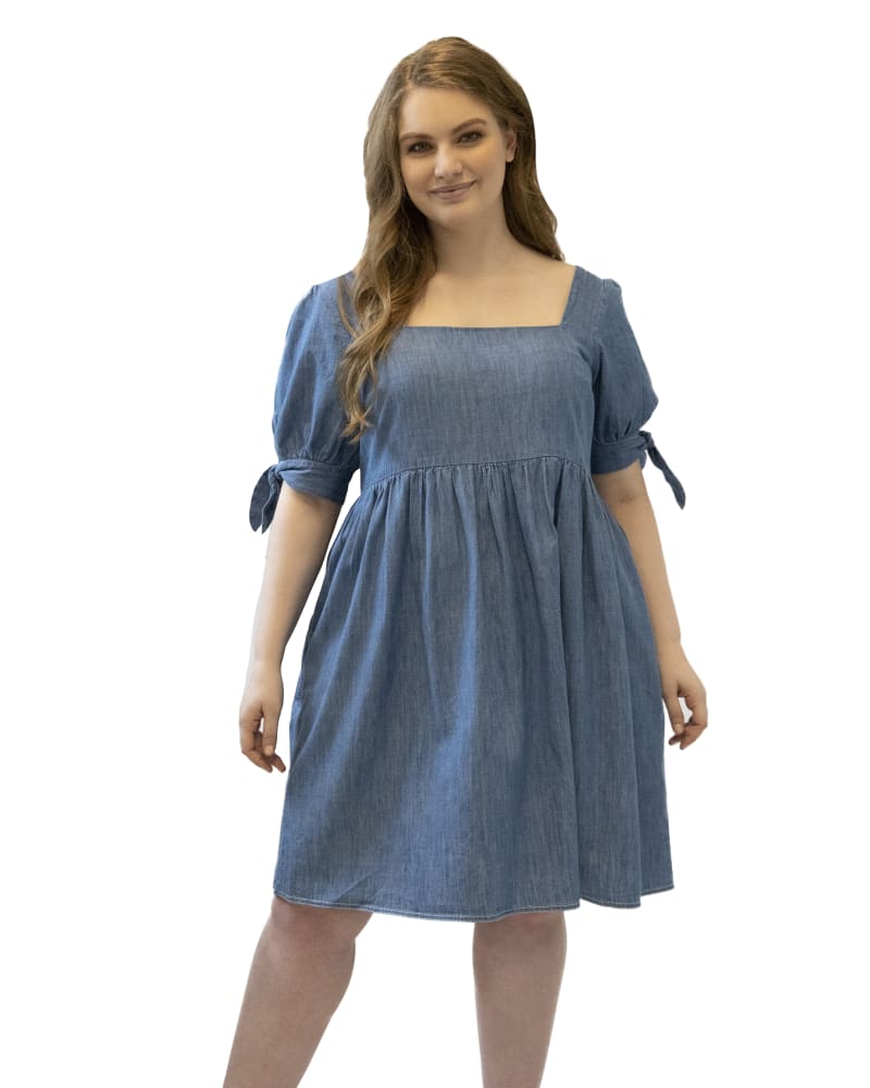 Front of a model wearing a size 16 Babydoll Denim Dress in Denim Wash by Maree Pour Toi. | dia_product_style_image_id:235842